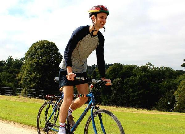 A smiling cyclist at Newton Park campus