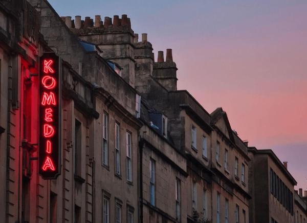 the Komedia building at sunset 