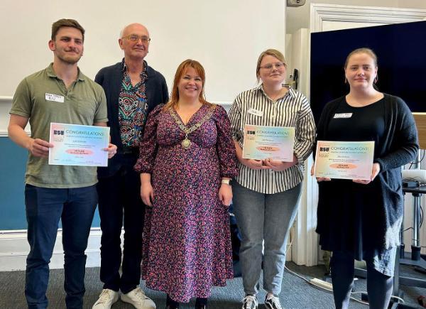 the winners of the competition stood next to the mayor of Bath with their certificates